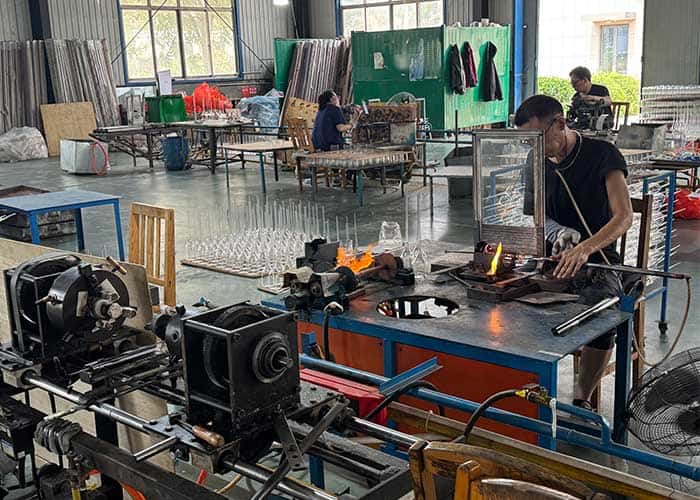 High-quality glass lampshades being crafted in a professional manufacturing workshop. Skilled worker.