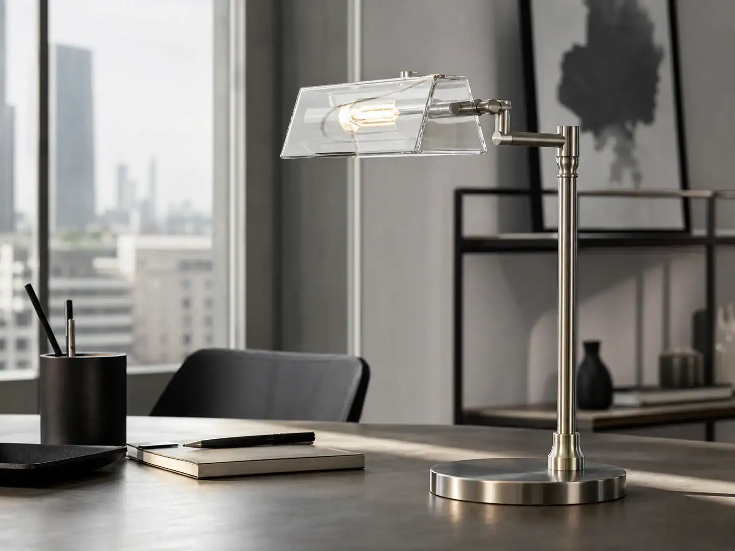 Contemporary glass lampshade on a sleek desk in a modern office setting.