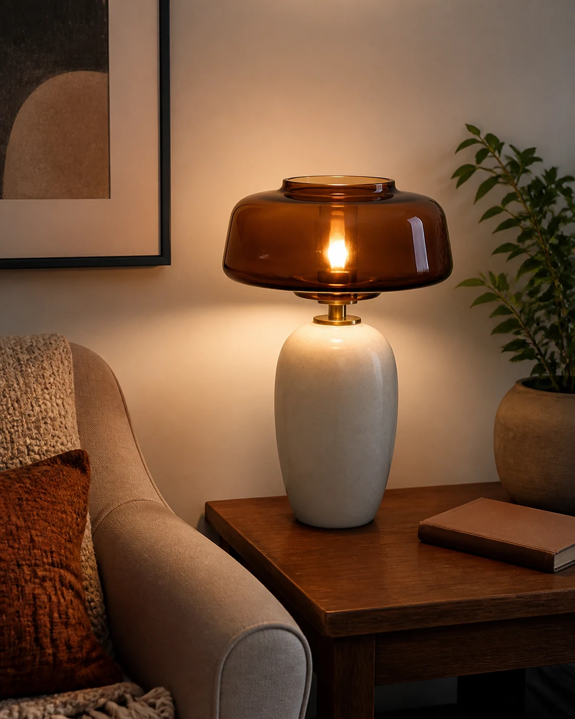 Brown glass table lamp shade proportioned to a ceramic base on a side table