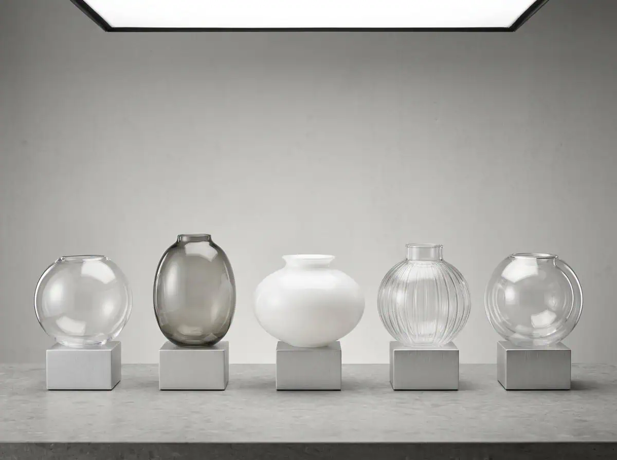 Collection of five modern glass lampshades in various shapes and finishes.