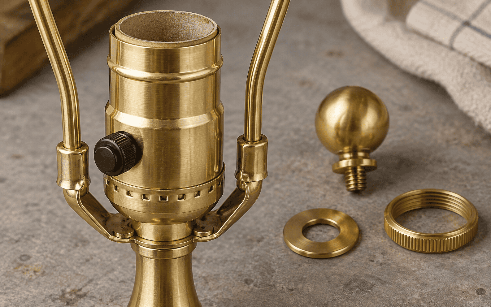 Brass lamp holder with accessories for custom glass lampshades.