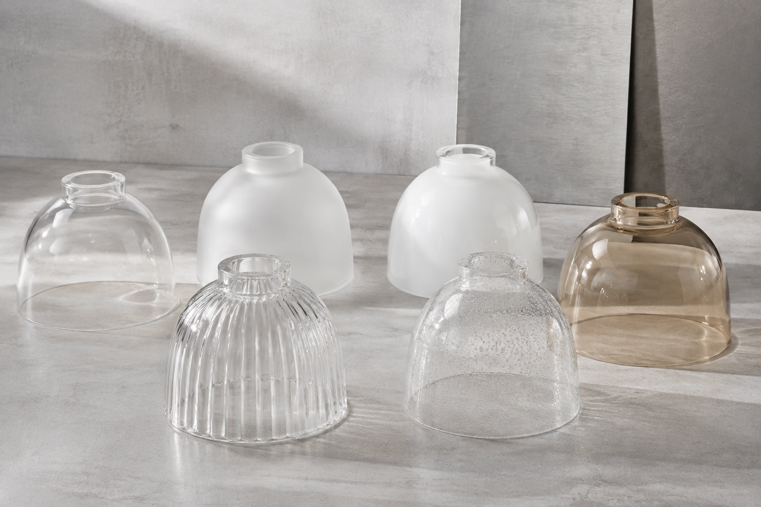 Clear, frosted, opal, ribbed, seeded and lightly amber glass shade samples for comparison