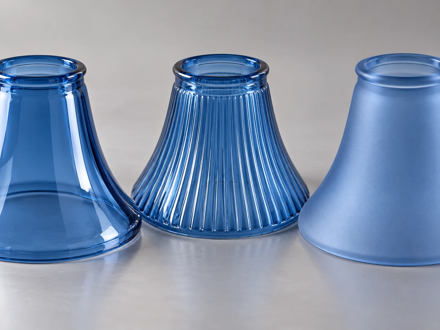 Smooth, ribbed and satin looking blue glass shade surface examples