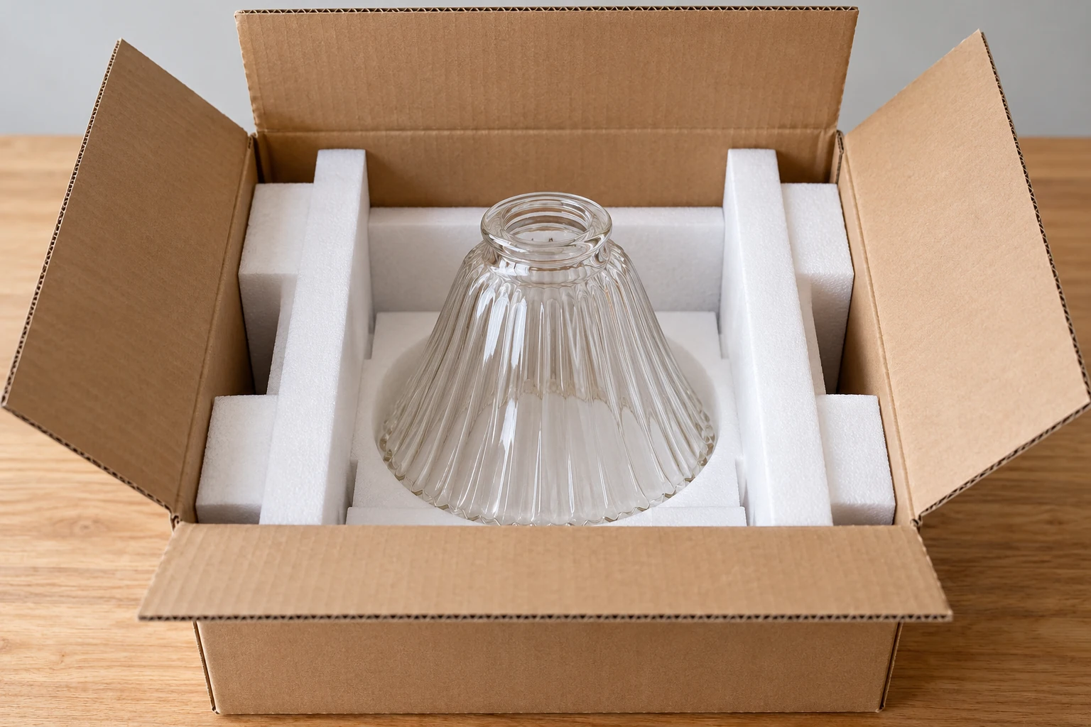 A single glass shade concept placed in separate protective dividers inside an unbranded carton